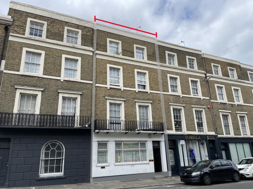Lot: 132 - THIRD FLOOR STUDIO FLAT WITH VACANT POSSESSION - Outside image of front of building from street level, flat and building marked for reference